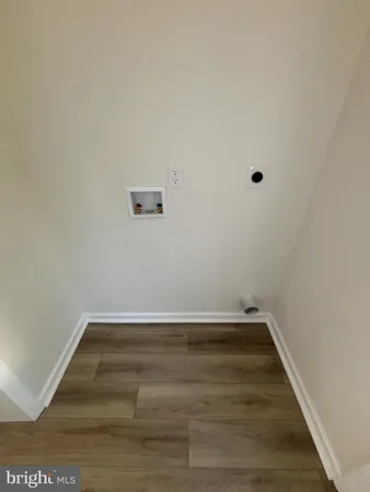 a view of room with wooden floor