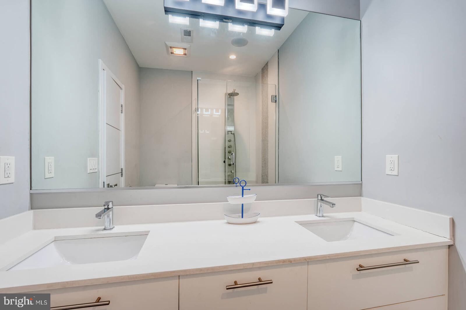 1461 Chapin Street Northwest Washington, DC 20009 - Photo 52 of 67 Sleek modern bathroom with dual sinks.