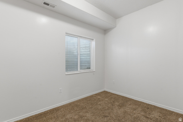 134 West 475 South Ogden, UT 84404 - Photo 19 of 27 Empty room with dark colored carpet and baseboards