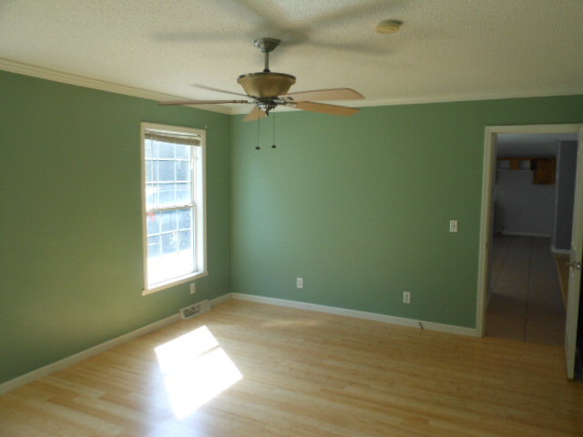 152 Morris Stevens Road Macon, GA 31217 - Photo 3 of 11 a view of empty room with window and fan