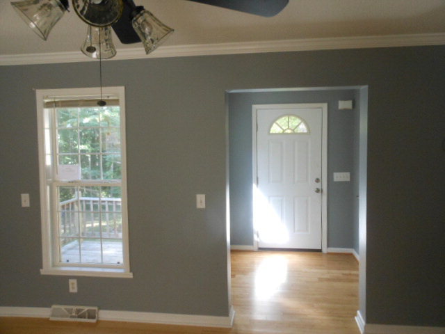 152 Morris Stevens Road Macon, GA 31217 - Photo 5 of 11 a view of an empty room with wooden floor and a window