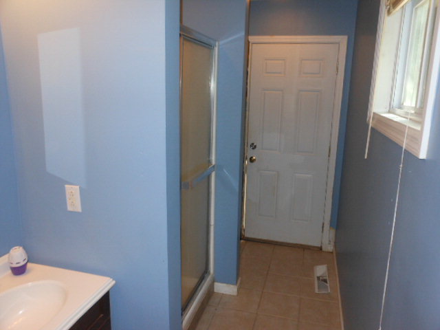 152 Morris Stevens Road Macon, GA 31217 - Photo 8 of 11 a bathroom with a sink and a window