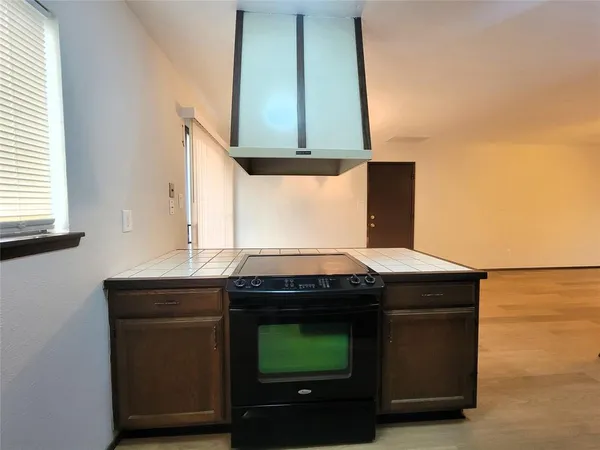 a kitchen with a stove and a microwave