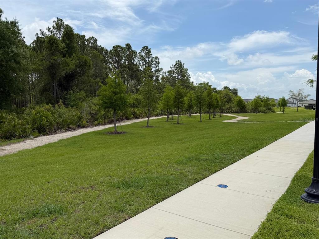 4244 Ranch House Road St. Cloud, FL 34772 - Photo 30 of 34 a view of a golf course with a garden