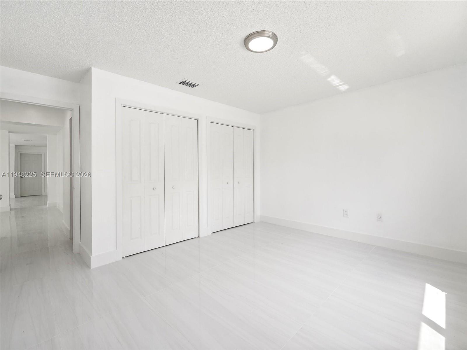 13841 Southwest 17th Terrace Miami, FL 33175 - Photo 11 of 31 an empty room with a natural light