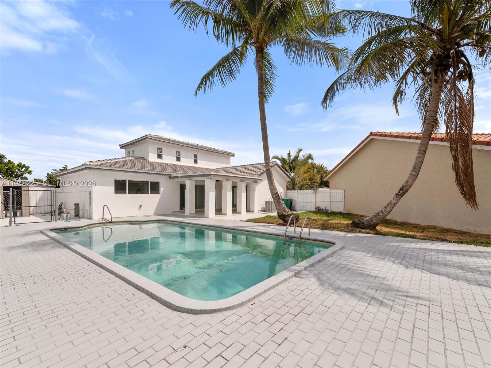 13841 Southwest 17th Terrace Miami, FL 33175 - Photo 31 of 31 a front view of house with yard and swimming pool