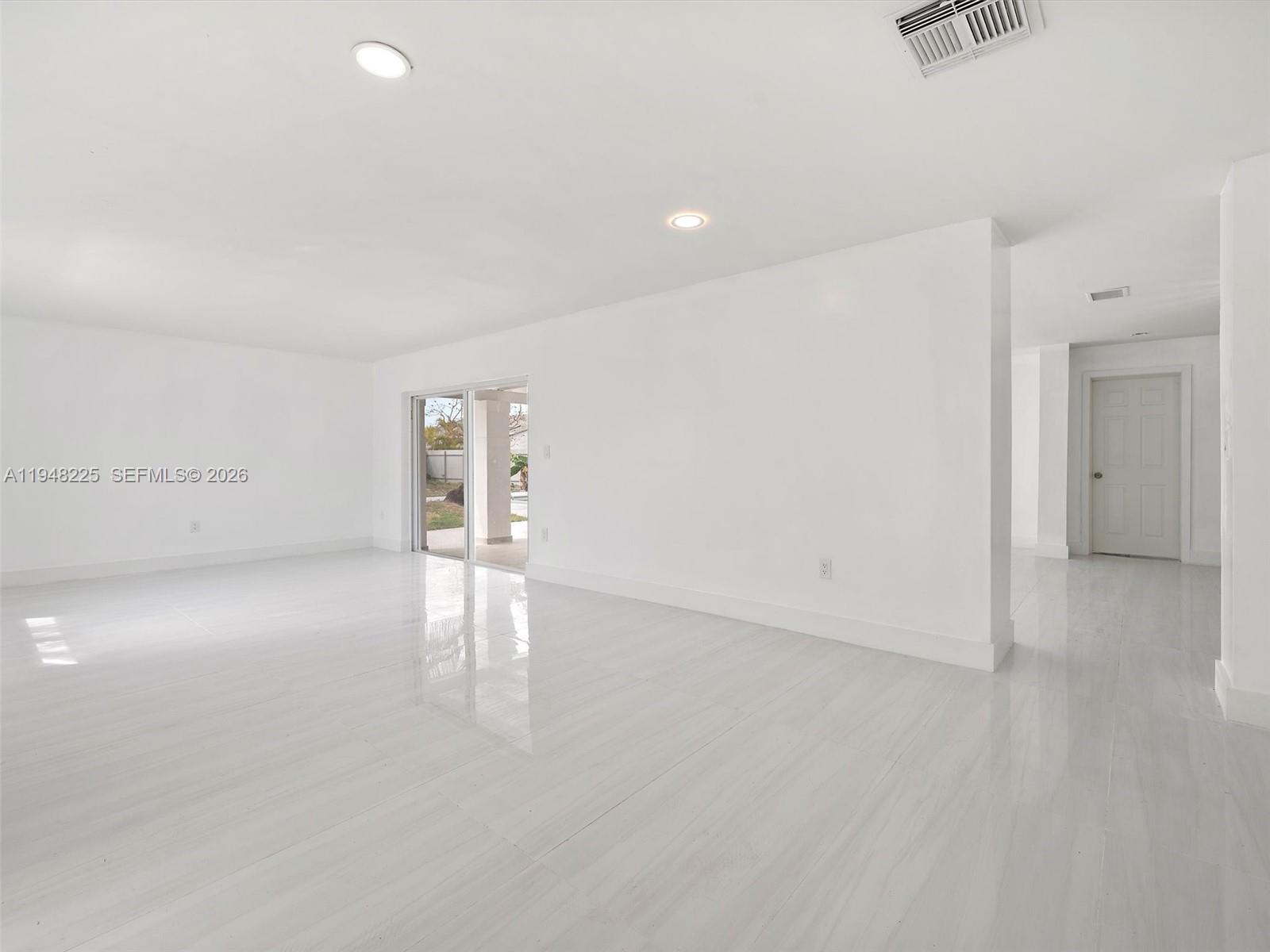 13841 Southwest 17th Terrace Miami, FL 33175 - Photo 8 of 31 a view of an empty room with a window
