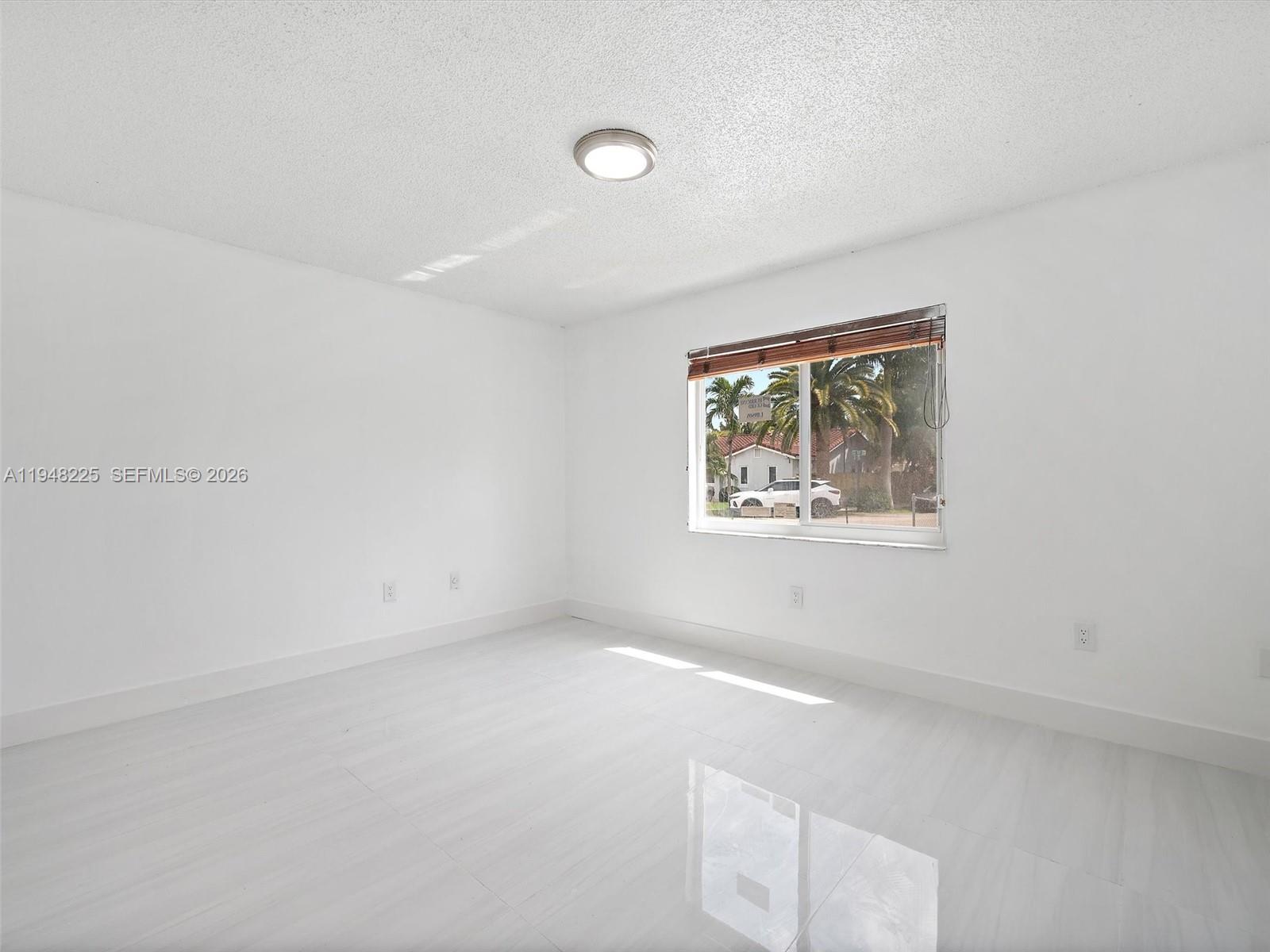 13841 Southwest 17th Terrace Miami, FL 33175 - Photo 10 of 31 an empty room with windows