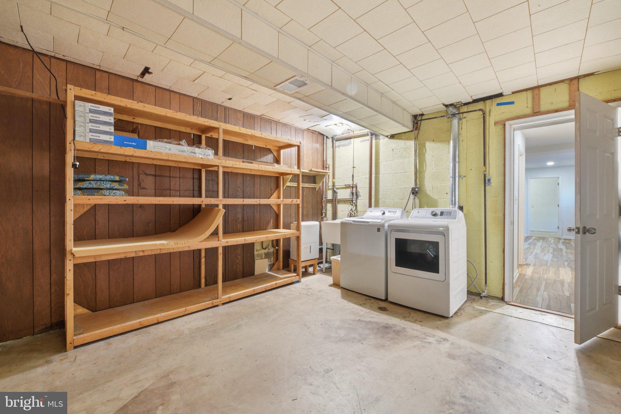 2311 Spencer Road Silver Spring, MD 20910 - Photo 32 of 36 Spacious laundry area with shelving.