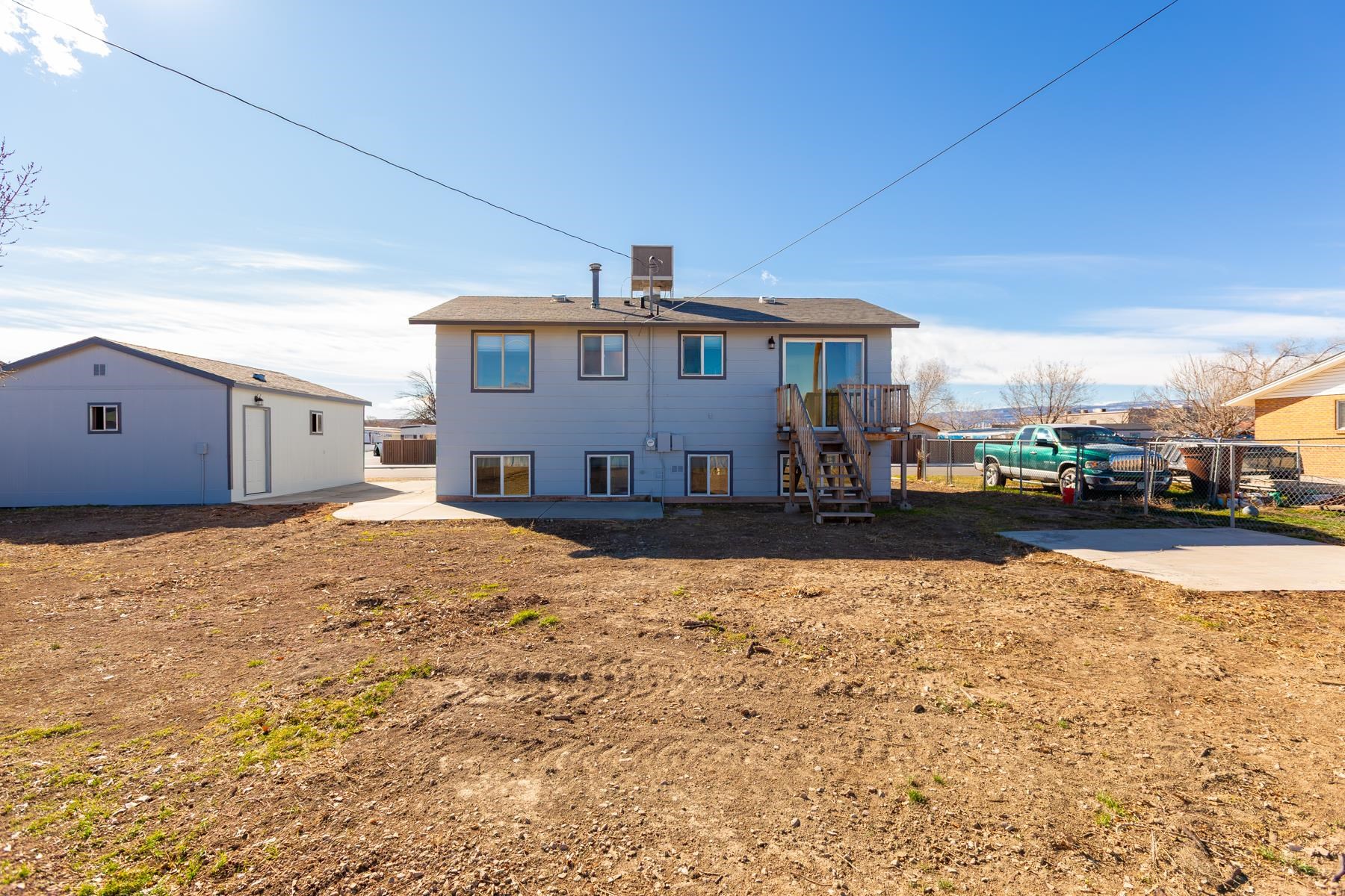3212 D D 1/4 Road Clifton, CO 81520 - Photo 23 of 25 a view of a house with a yard covered in snow
