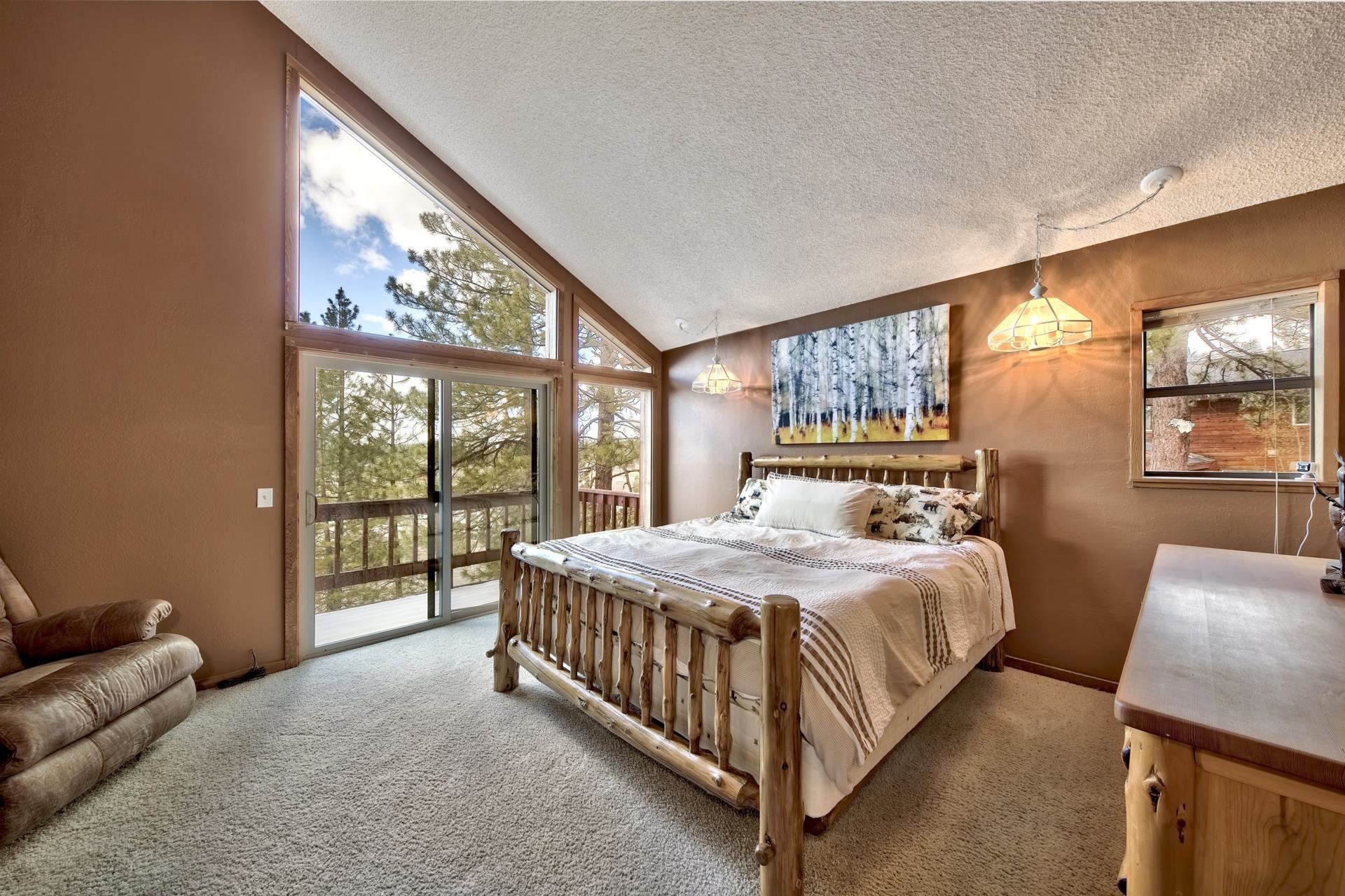 15541 Glenshire Drive Truckee, CA 96161 - Photo 8 of 21 a bedroom with a large bed and a large window