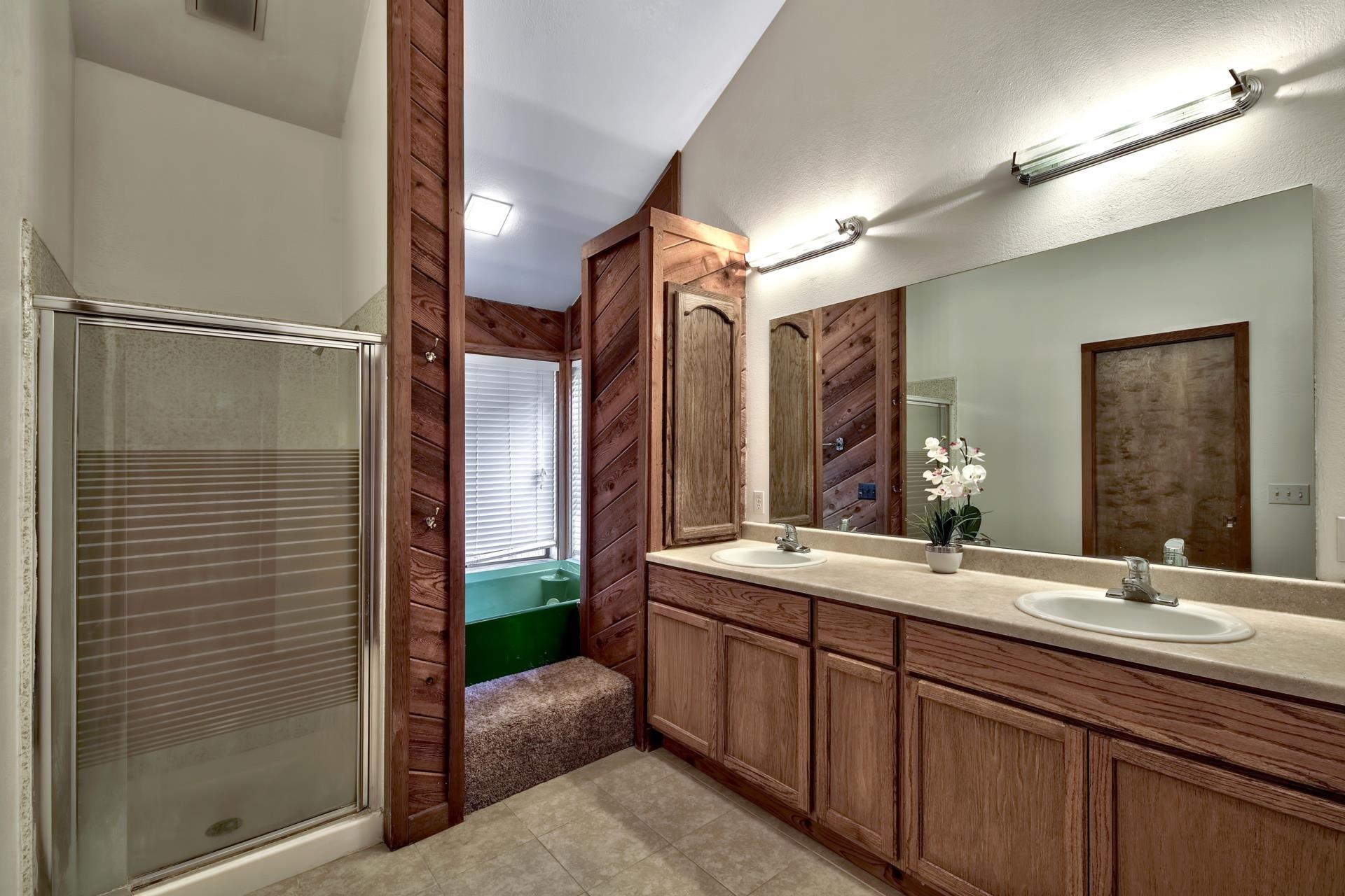 15541 Glenshire Drive Truckee, CA 96161 - Photo 9 of 21 a bathroom with a double vanity sink and a mirror
