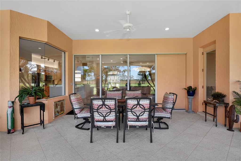 2968 Plantation Road Winter Haven, FL 33884 - Photo 50 of 81 a dining room with furniture and floor to ceiling window