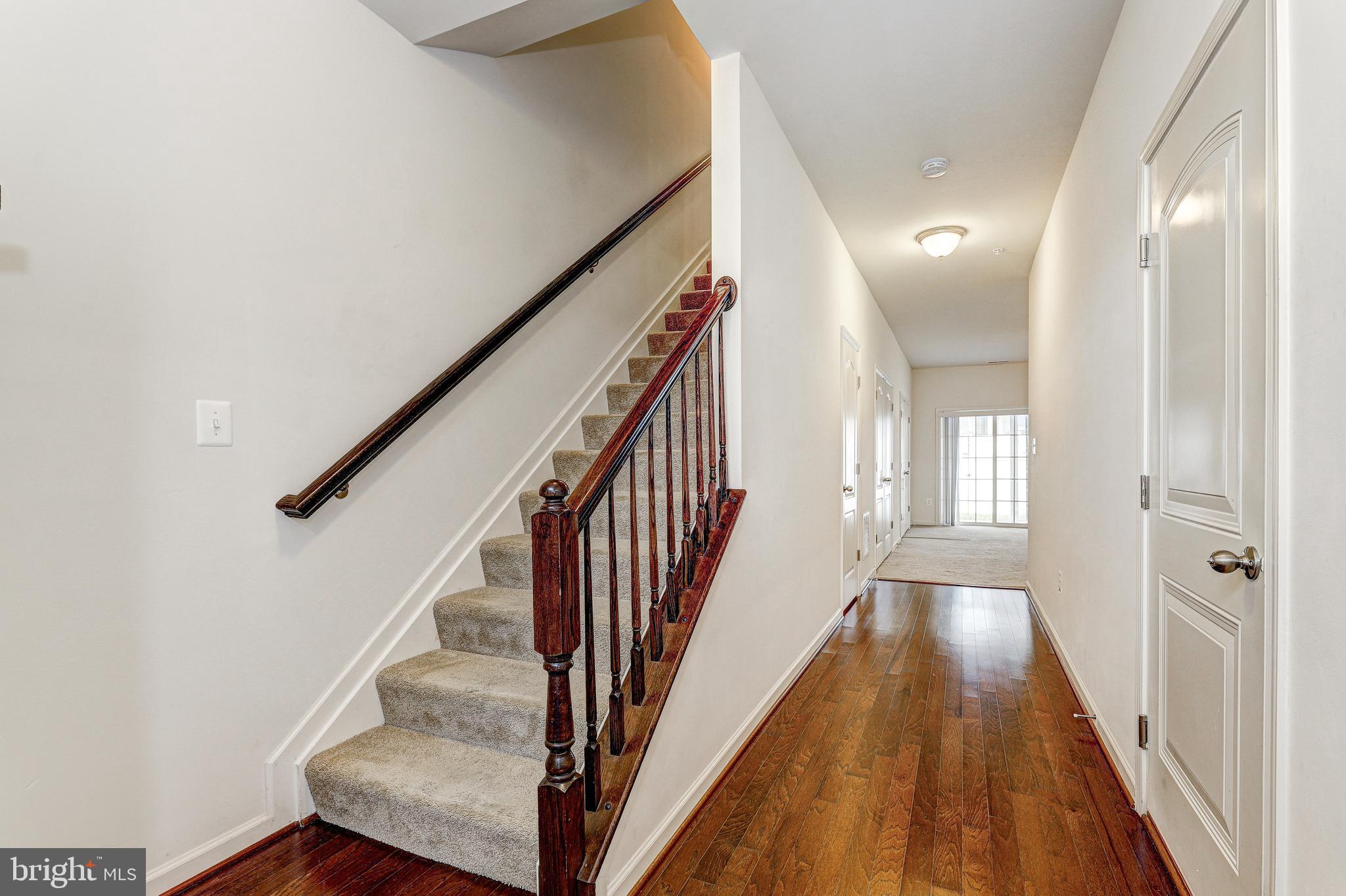 912 Winter Run Road Middle River, MD 21220 - Photo 4 of 55 a view of a hallway with wooden floor and staircase