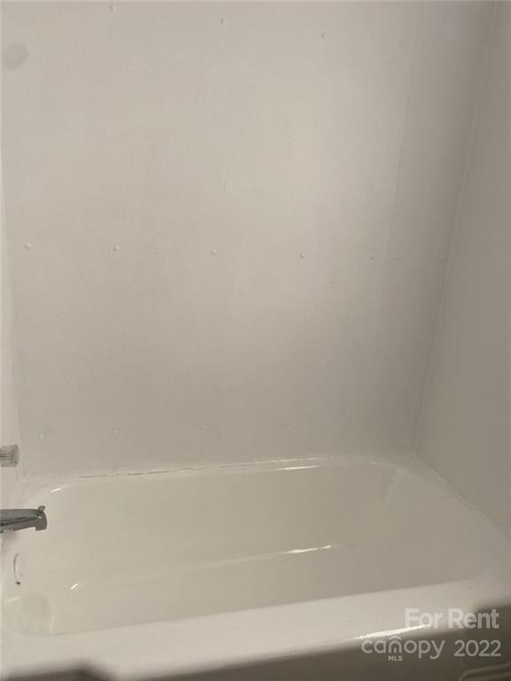 725 Tom Sadler Road Charlotte, NC 28214 - Photo 7 of 9 a close up of a bathtub
