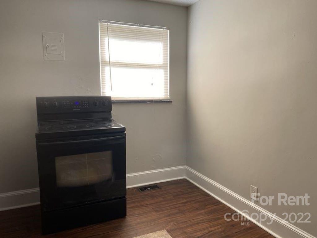 725 Tom Sadler Road Charlotte, NC 28214 - Photo 9 of 9 a room with a fireplace and a window