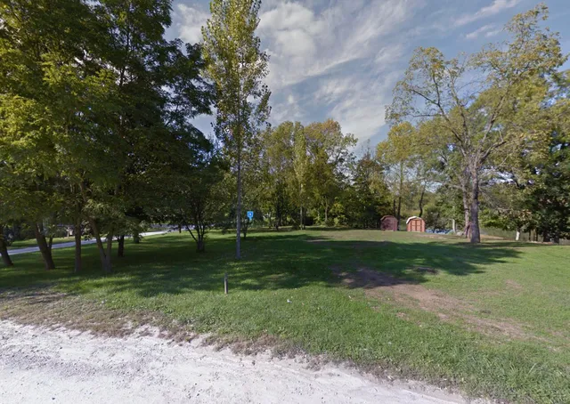 a backyard of a house with lots of green space