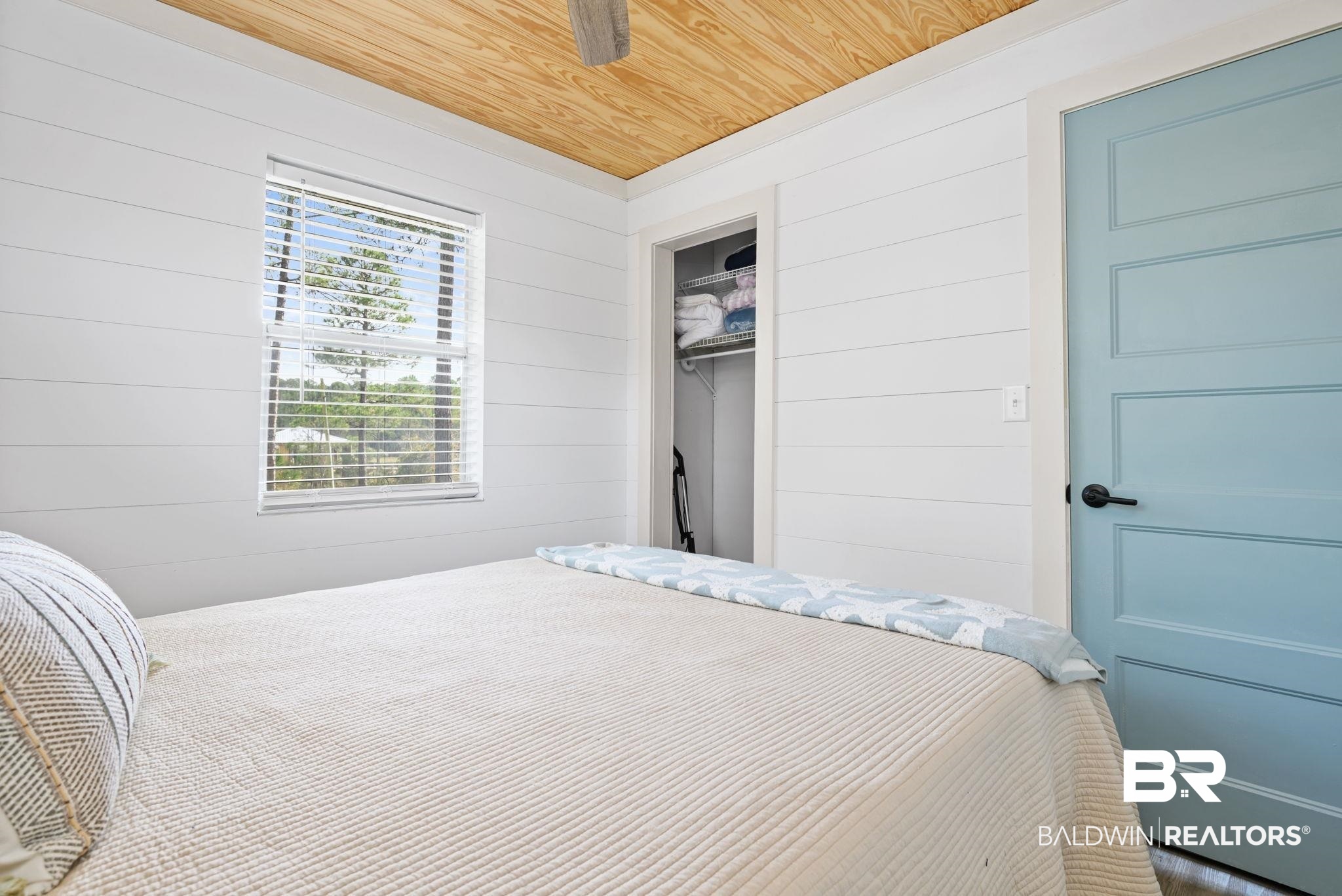 7947 Bayshore Drive Elberta, AL 36530 - Photo 23 of 26 Bedroom with wooden walls, wood ceiling, and a closet