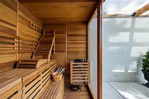 a view of a house with a backyard porch and sitting area