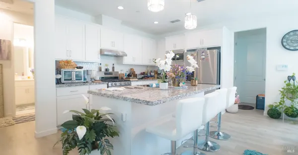 a kitchen with granite countertop living room and living room