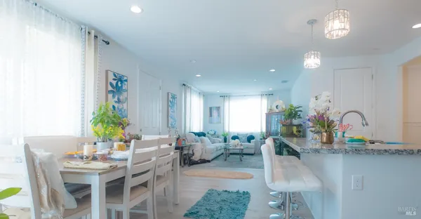 an entryway with dining table and chairs