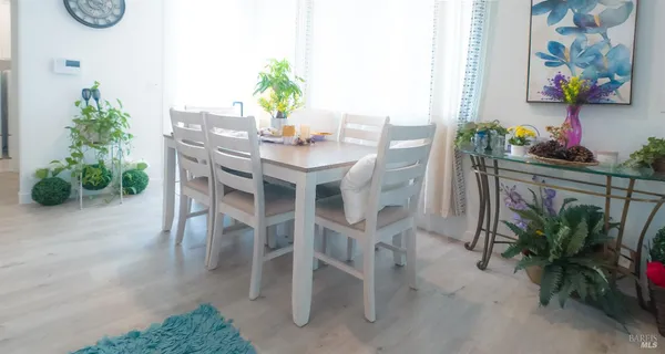 a view of house with backyard and furniture
