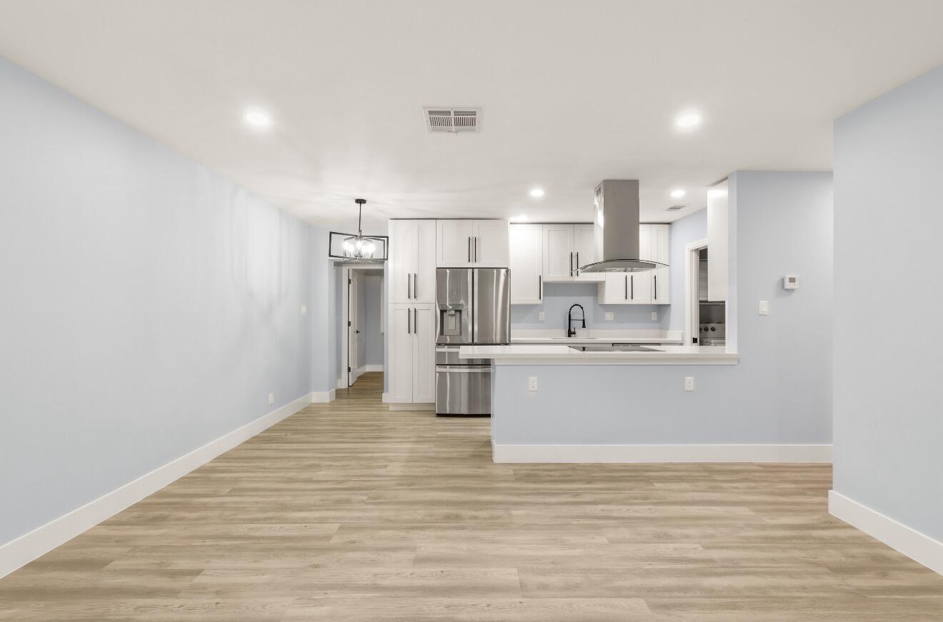 6717 Northwest 60th Street Tamarac, FL 33321 - Photo 2 of 26 a view of kitchen with wooden floor