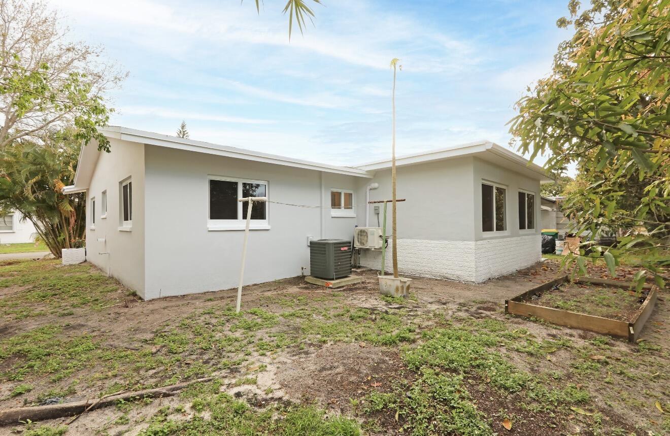 6717 Northwest 60th Street Tamarac, FL 33321 - Photo 24 of 26 a view of a house with backyard