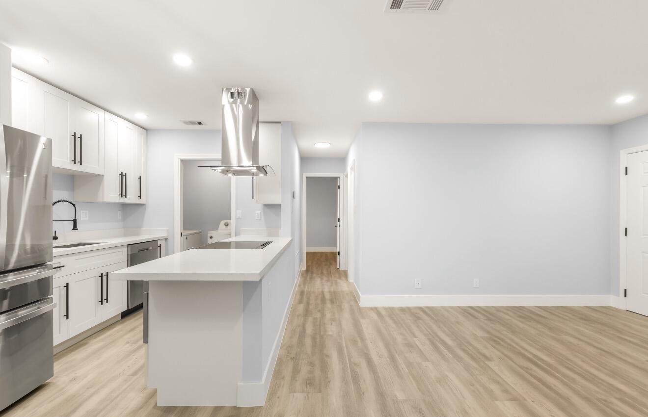 6717 Northwest 60th Street Tamarac, FL 33321 - Photo 8 of 26 a kitchen with stainless steel appliances a sink and cabinets