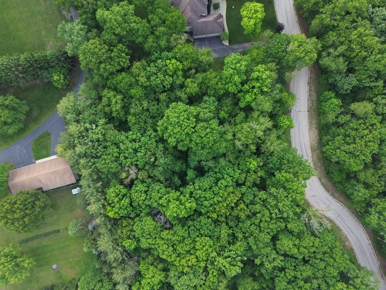 7407 Forest Oak Drive McHenry, IL 60050 - Photo 11 of 11 an aerial view of a house with a yard and outdoor seating