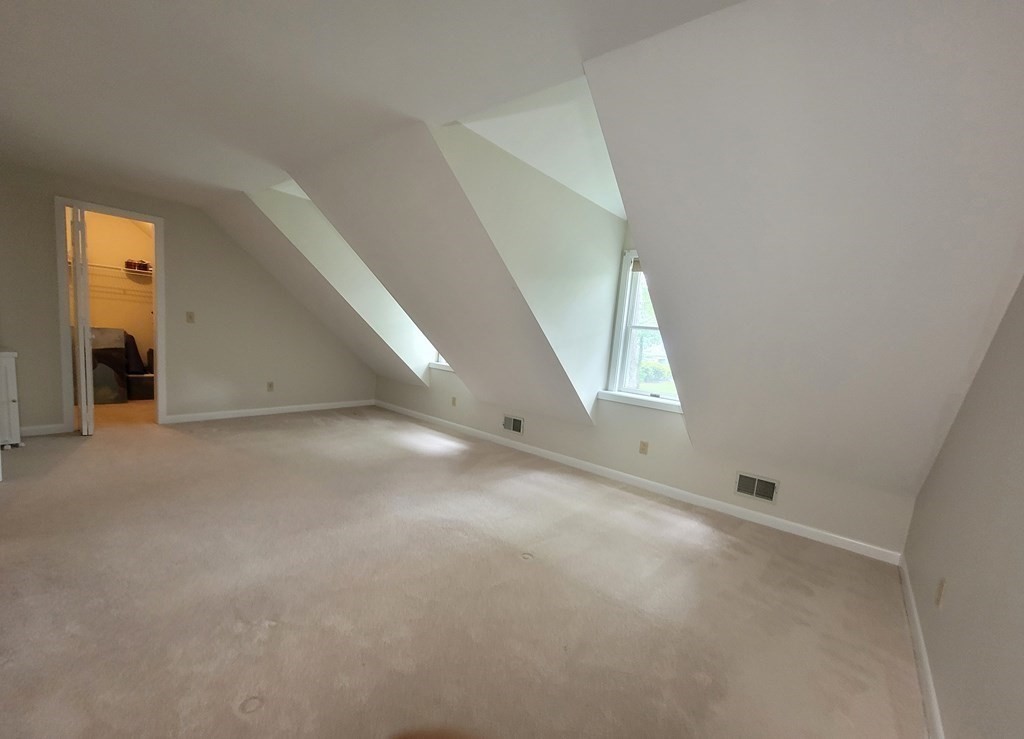 105 Shellback Way, Unit 105 Mashpee, MA 02649 - Photo 11 of 26 a view of an empty room with a window