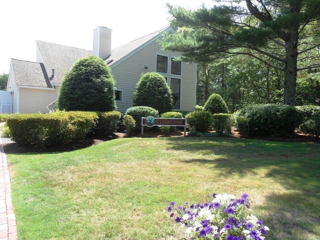 105 Shellback Way, Unit 105 Mashpee, MA 02649 - Photo 17 of 26 a view of a house with a backyard and sitting area