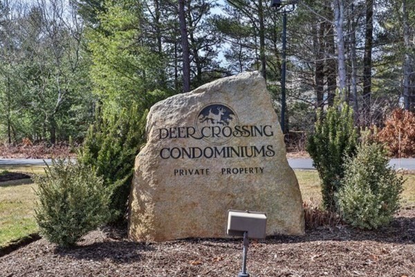 105 Shellback Way, Unit 105 Mashpee, MA 02649 - Photo 20 of 26 a sign on the side of the road