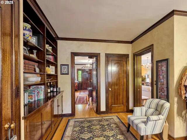 a living room with furniture and a book shelf