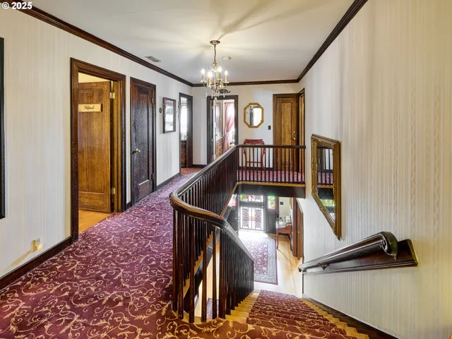 a view of entryway and hall with a front door