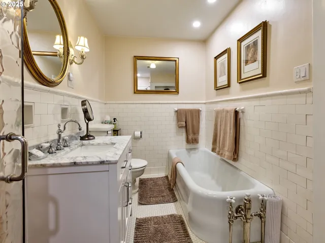 a bedroom with a bed and a couch