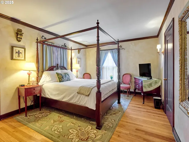 a spacious bathroom with a double vanity sink a mirror and a shower
