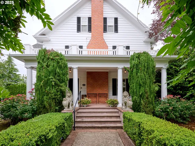 a view of a patio with couches chairs and wooden floor