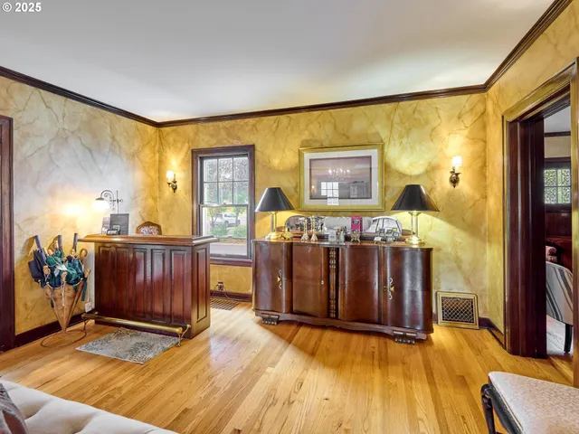 a living room with furniture window and wooden floor