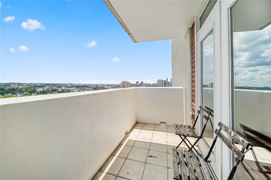 375 Ralph McGill Boulevard Northeast, Unit 1402 Atlanta, GA 30312 - Photo 14 of 17 a view of a room with wooden floor and windows