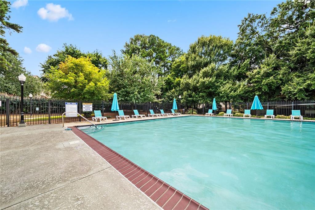 375 Ralph McGill Boulevard Northeast, Unit 1402 Atlanta, GA 30312 - Photo 17 of 17 a view of a house with a yard