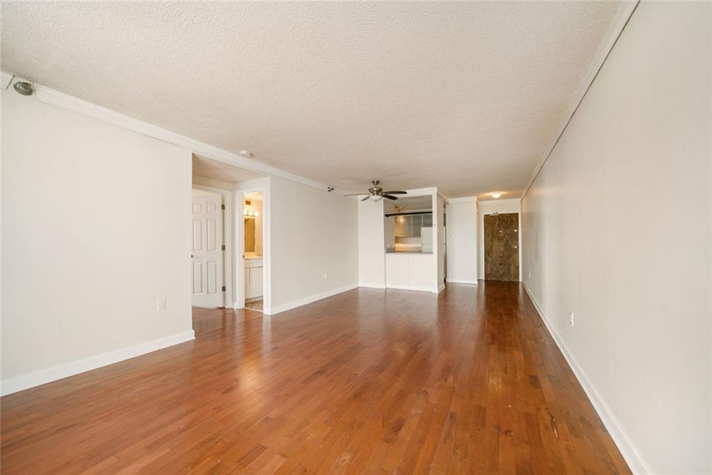 375 Ralph McGill Boulevard Northeast, Unit 1402 Atlanta, GA 30312 - Photo 6 of 17 a view of empty room with wooden floor