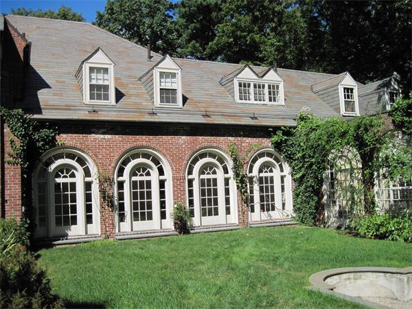 90 Sargent Road Brookline, MA 02445 - Photo 8 of 9 a front view of a house with garden