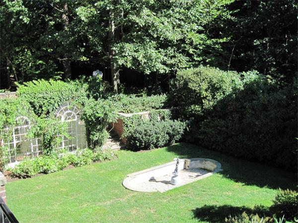 90 Sargent Road Brookline, MA 02445 - Photo 9 of 9 a backyard of a house with a yard