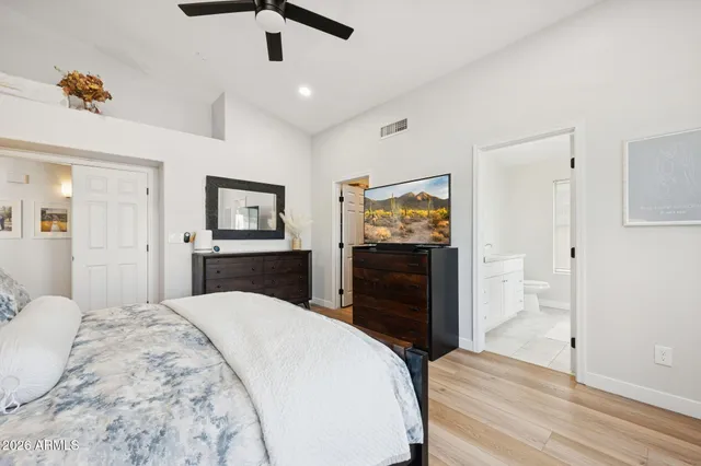 a bedroom with a bed and a view of bathroom