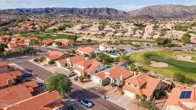 an aerial view of residential houses with outdoor space