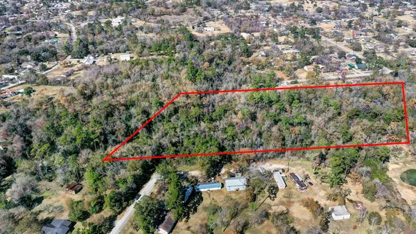 a view of a flower garden in a backyard