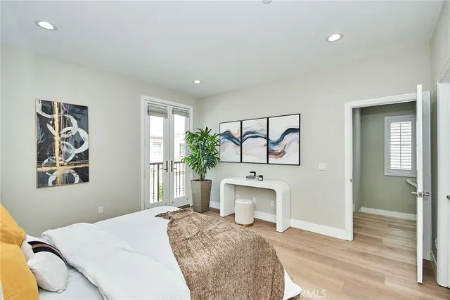 a bedroom with a bed and a fireplace