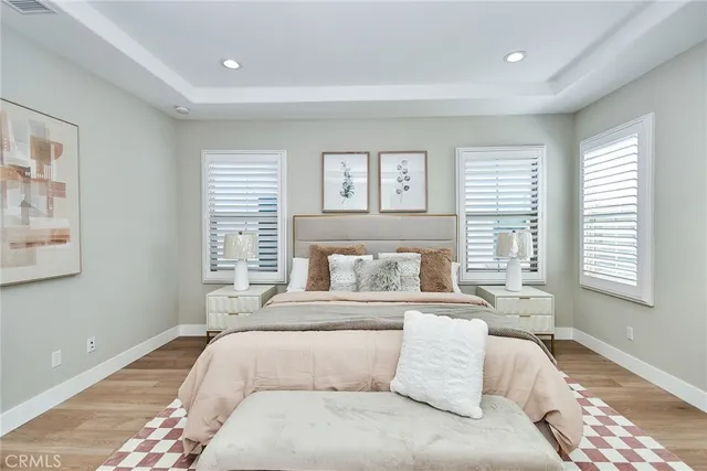 a bedroom with a large bed and a couch