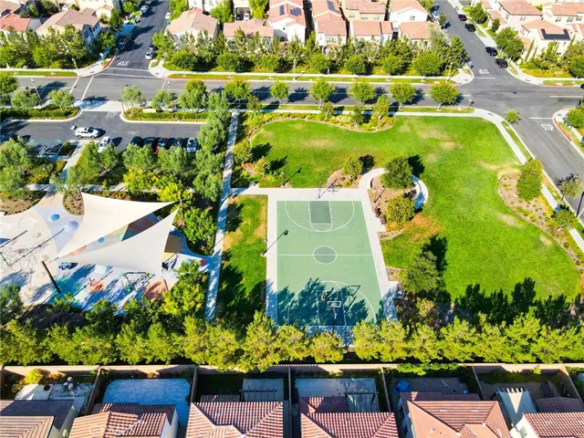an aerial view of a houses with a city street